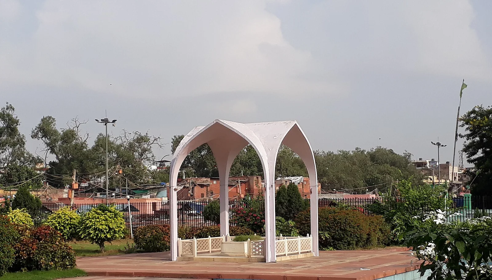 The white arched canopy over the tomb of Maulana Abul Kalam Azad in a landscaped enclosure in Old Delhi, near the Jama Masjid.